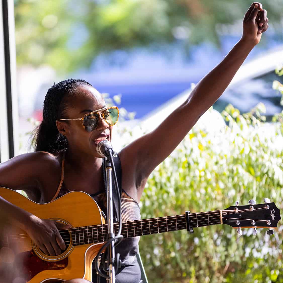 Guitarist raising fist while performing